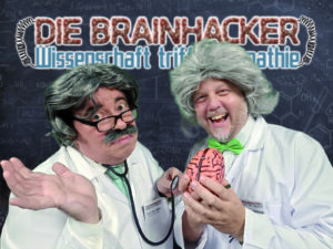Die Brainhacker – zwei Professoren mit Gehirnwellen-Verstärker in einer 30-minütigen Wissenschafts- und Telepathie-Comedyshow für Firmenevents.